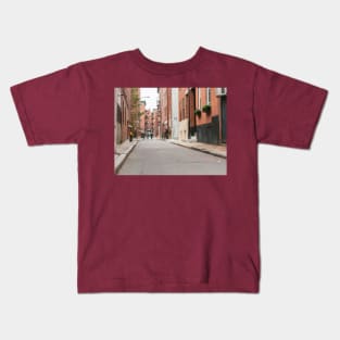 Boston back street background image with focus on foreground and blurry urban beyond, USA. Kids T-Shirt